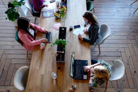 Decorative Image: Team of workers at a table working